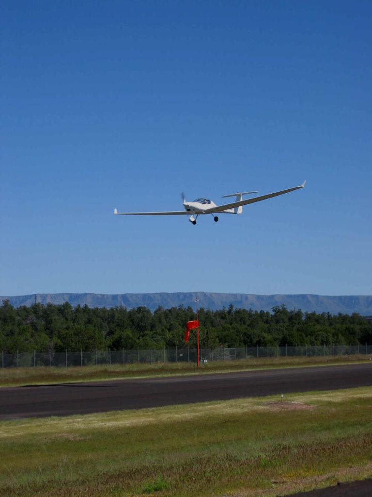 motorglider over Payson Airport runway